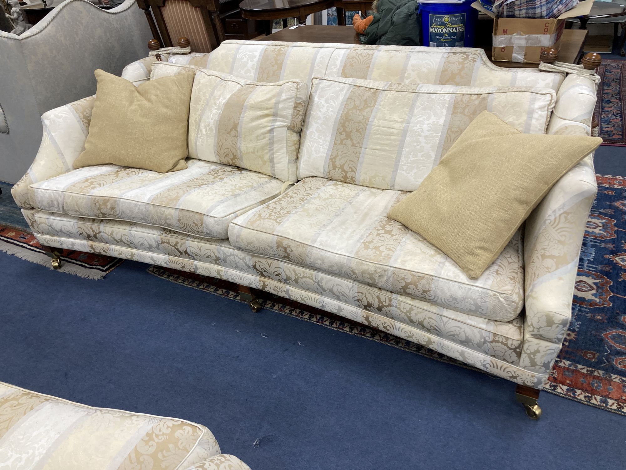 Harrods. Two large two seater settees, upholstered in cream brocade, larger 238cm, depth 118cm, height 85cm